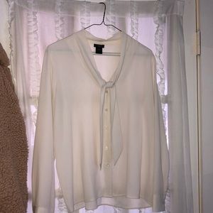 White button down with a tied collar